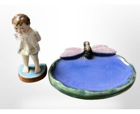 A Royal Worcester figure, 'Tommy' No.2913, modelled by F. G. Doughty, height 11 cm, together with a pottery soap dish surmoun