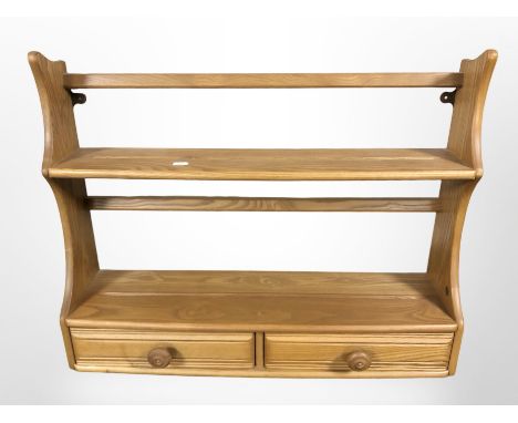 An Ercol elm two drawer plate rack, width 70 cm.
