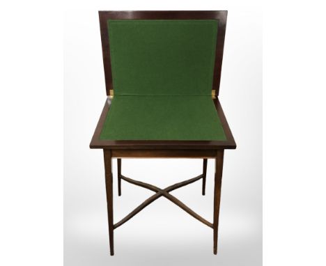 An Edwardian mahogany card table, width 52 cm.