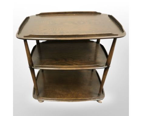 An Ercol stained elm three tier trolley, width 71 cm 