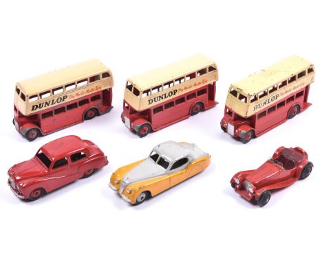 6 Dinky Toys.  Austin Somerset Saloon (161) in red with red wheels. A Jaguar XK120 (157) in yellow and grey. All Both with th