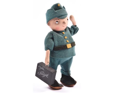A rare 1930's German walking mechanical soldier 'Private Shenk'. 21cm in height, wearing a felt German green uniform, with wa