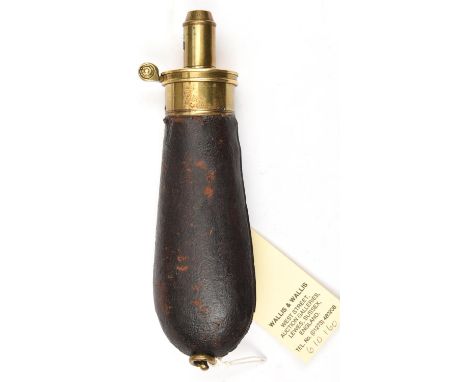 A slender bag shaped powder flask, dark brown leather covered body (worn at the seam), patent brass top by ‘G &amp; J W Hawks