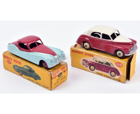 2 Dinky Toys. Morris Oxford Saloon (159). An example in cerise and cream with beige wheels. Together with a Jaguar XK120 (157