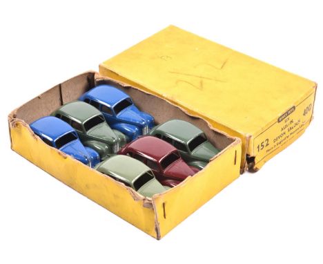 A scarce Dinky Toys Trade Pack for 'Six Austin Devon Saloon 152/40D. Containing 6 examples, one in maroon with maroon wheels.