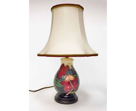 MODERN MOORCROFT TABLE LAMP BASEdecorated with stylised tube-lined floral motifs in predominantly wine and peach tones, on a 