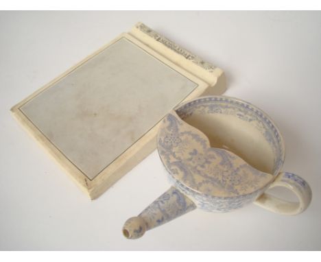 A 19th Century blue and white transfer decorated feeding cup together with a ceramic memoranda block (2). 
