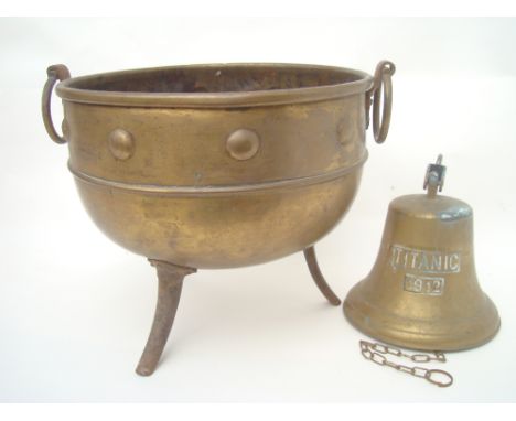 A bronze bell with wall bracket 'Titanic 1912' and a brass coal bin with ring handles (2). 