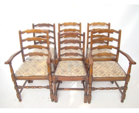 A set of six oak ladder back dining chairs including a pair of elbow chairs.  