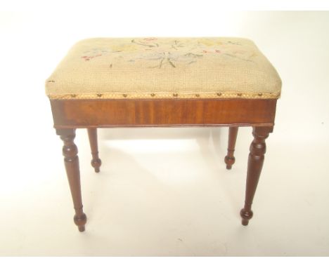 An early 19th Century mahogany commode stool with tapestry stuffover seat.  