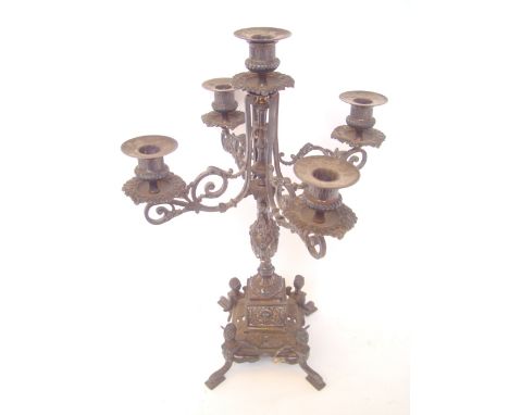 An electroplated five light candelabrum with drip pans. 