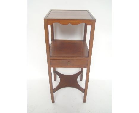 A George III mahogany wash stand, the square top above an open shelf and single drawer, raised on square legs united by a pla