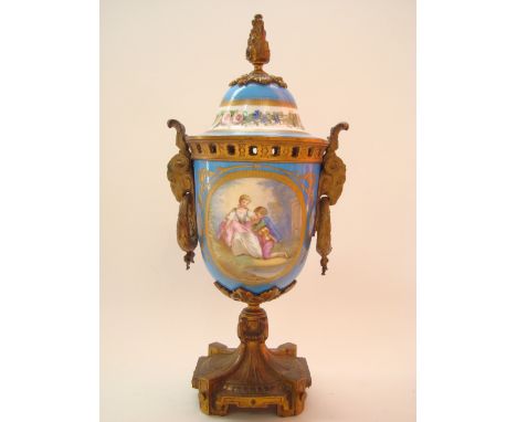 A 19th Century Sevres style porcelain gilt metal mounted vase and cover, the vase painted with oval Watteauesque panel, depic