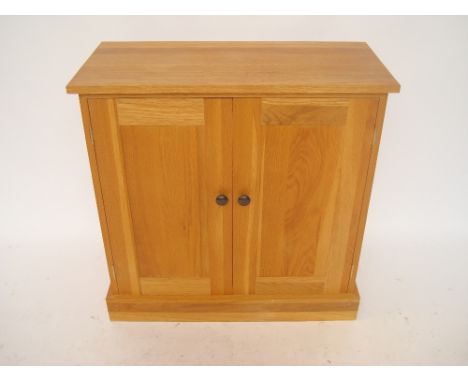 A light oak cupboard. 