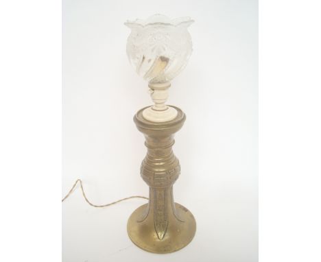 A Chinese polished altar candlestick fitted as a table lamp. 