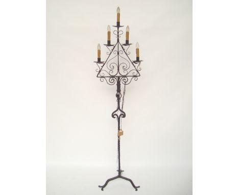 A wrought iron five light floor candelabra fitted for electricity. 