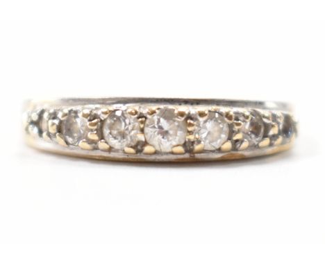 A hallmarked 9ct gold &amp; CZ half hoop ring. Hallmarked for London. Weight approx; 1.9g. Size N.