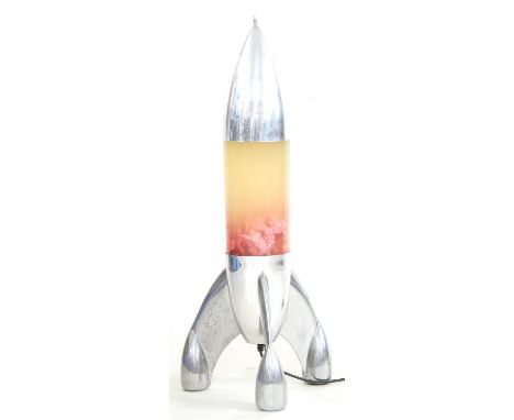 A large retro lava lamp, in the form of a rocket with chrome nozzle, glass body and chrome base, 84cm high