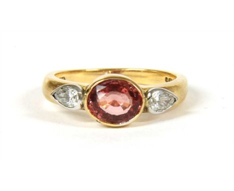 An 18ct rose gold and white gold single stone orange sapphire ring, with diamond set shoulders, an oval mixed cut orange sapp