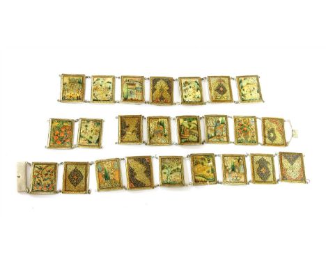 An early 20th century Persian mother of pearl panelled belt , the panels decorated with figures in landscape hunting scenes, 