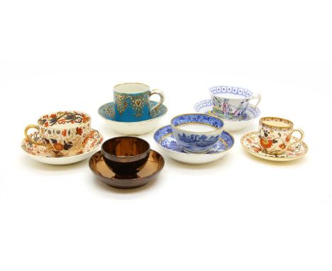 A collection of porcelain tablewares, comprising tea bowls and saucers, tea cups and saucers and coffee cups and saucers, to 