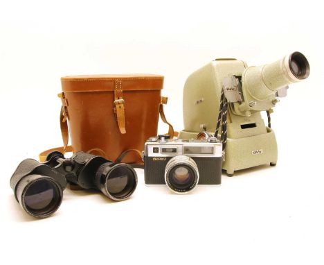 A collection of cameras, to include a Yashica Electro 35, Kodak Brownie, a Minox spy camera, etc, together with a projector a