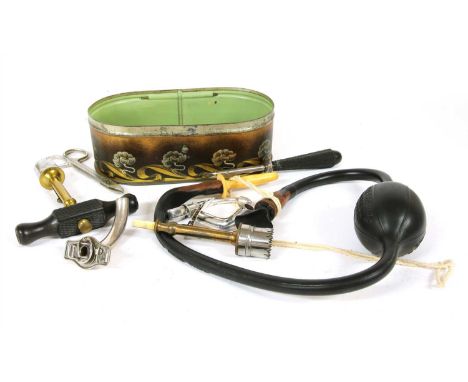 A collection of antique medical equipment, to include a silver catheter, coromandel treppaning tools and an Enema syringe (Qt
