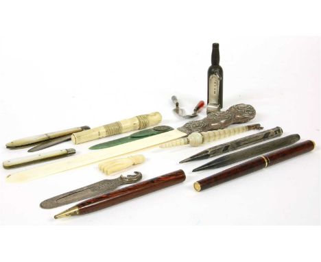 A collection of desk items, to include a silver and ivory page turner, a silver bookmark with crescent moon finial by Sampson