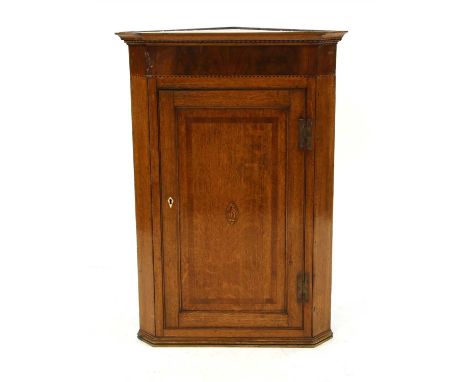 A George III inlaid oak corner cabinet, with single panel door enclosing shelves, 92cm wide, 112cm high