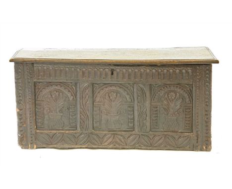 An 18th century carved oak three panel coffer, the arched panels with foliate decoration, 110cm wide, 40cm deep, 50cm high