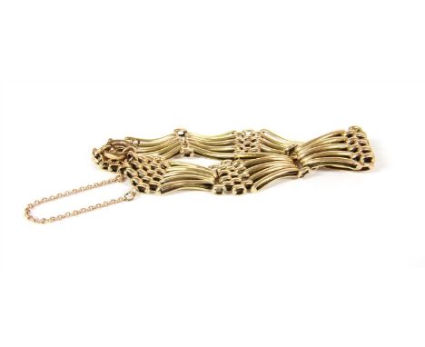An Edwardian five row fan shaped gate bracelet, with a later rolled gold clasp, tested as approximately 9ct gold, 14.42g (exc