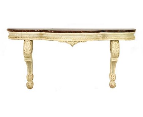 A pair of carved and painted console tables, with shaped rouge marbles tops, on scrolling central supports, 55cm wide, 28cm d