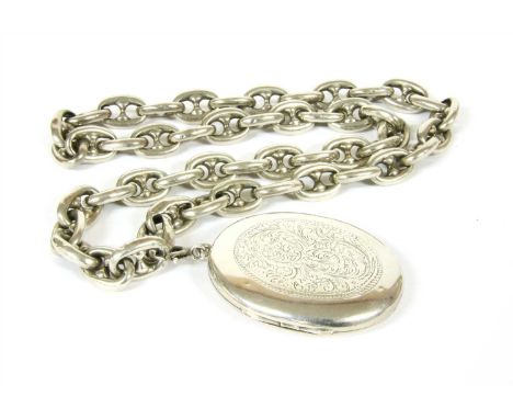 A Victorian silver hinged locket, with carved foliate panel and monogram verso, on a hollow Victorian anchor chain