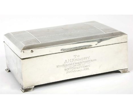 A George V silver table cigarette box, by Goldsmiths and Silversmiths Co. Ltd., Birmingham 1929, the hinged lid with engine t