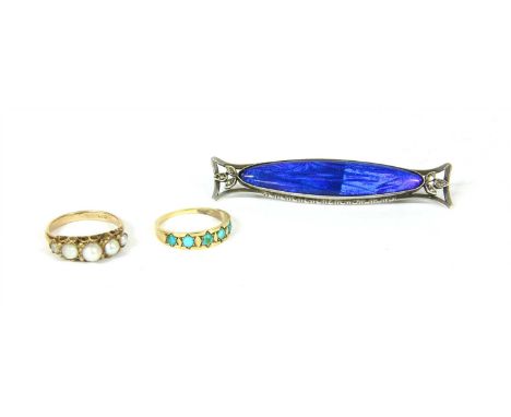 An 18ct gold and turquoise ring, set with five graduated cabochon stones within star shaped claw mounts on a plain polished s