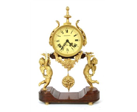 A 20th century Charles Beyfus of London portico clock , the off white dial, with Roman numeral, hour markers, supported by gi