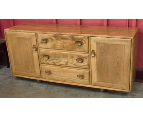 An Ercol Blonde elm Windsor sideboard 