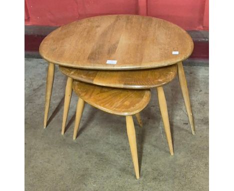 An Ercol Blonde elm and beech pebble shaped nest of tables 