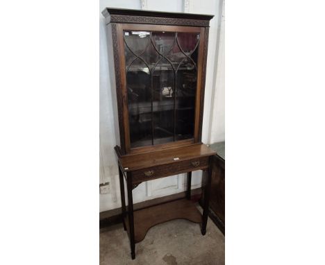 An Edward VII Chippendale Revival carved mahogany cabinet on stand 