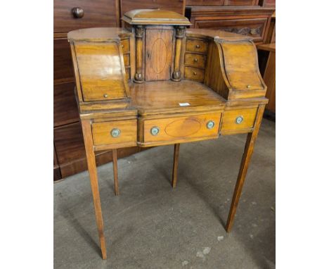 A Regency style inlaid satinwood Carlton House desk 
