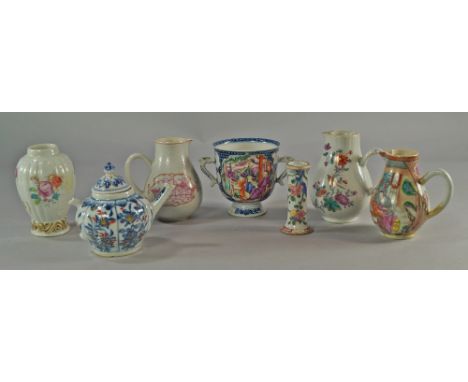 A Chinese porcelain twin handled cup, 18th century, painted with reserves of people in landscapes, on blue vermicule grounds,