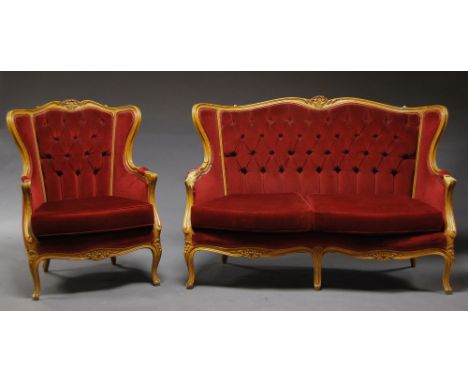 A French style carved wood red upholstered sofa, together with two matching armchairs,(a/f) (3).  CONDITION REPORT: Arms to s