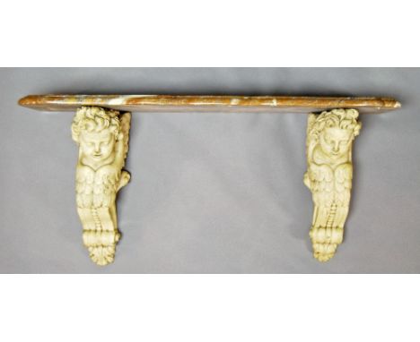 An Italian carved painted pine and marble console table, with shaped pink marble top, supported on two carved corbels in the 