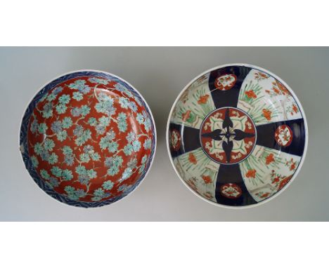 A Japanese Imari bowl, 19th century, painted to the interior with leaves on a red ground, 24cm diameter, together with anothe