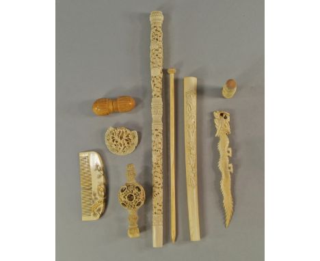 A Chinese Cantonese ivory baton, late 19th/early 20th century, carved with coiling dragons and phoenix, on grounds of stylise