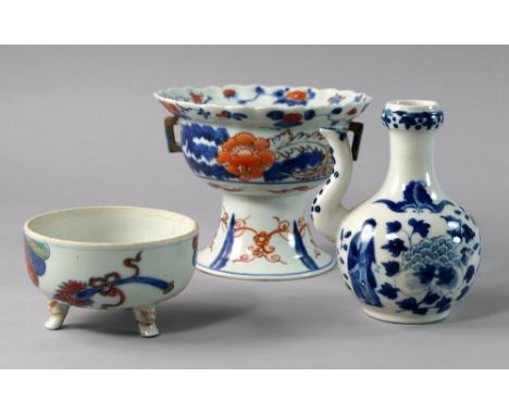 A Japanese comport, 18/19th century, decorated in the Imari palate with bands of flowers to rim and bowl, on a spreading foot