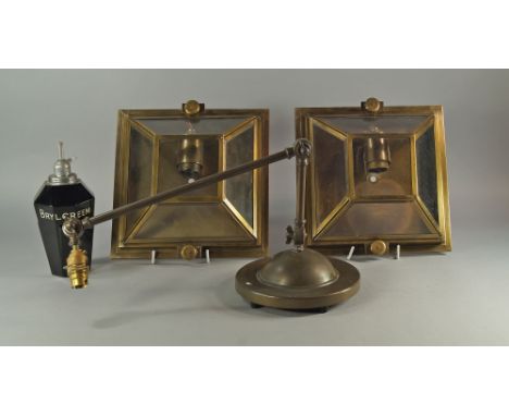 A patinated metal adjustable lamp stand, 20th century, in two sections with three positional clamps, on a domed weighted base
