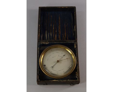 An Aneroid barometer, 19th century, engraved to the reverse Sold by E and E Emanuel The Hard Portsea, in a leather case, the 