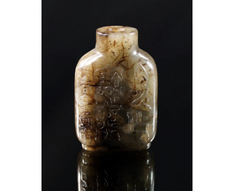 A Chinese carved mottled dark green jade, 19th century, carved in the round with script, raised on cylindrical foot, 6.5 cm h