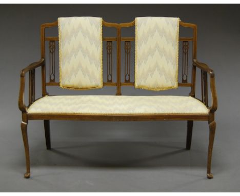 A mahogany and line inlaid two seat salon sofa, 20th century, with a padded back and seat cover, on slender cabriole legs.